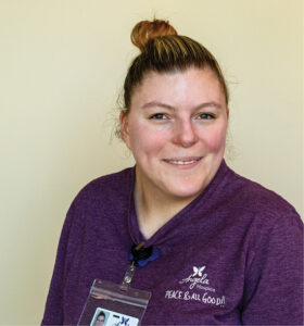 a woman smiling wearing an Angela Hospice shirt