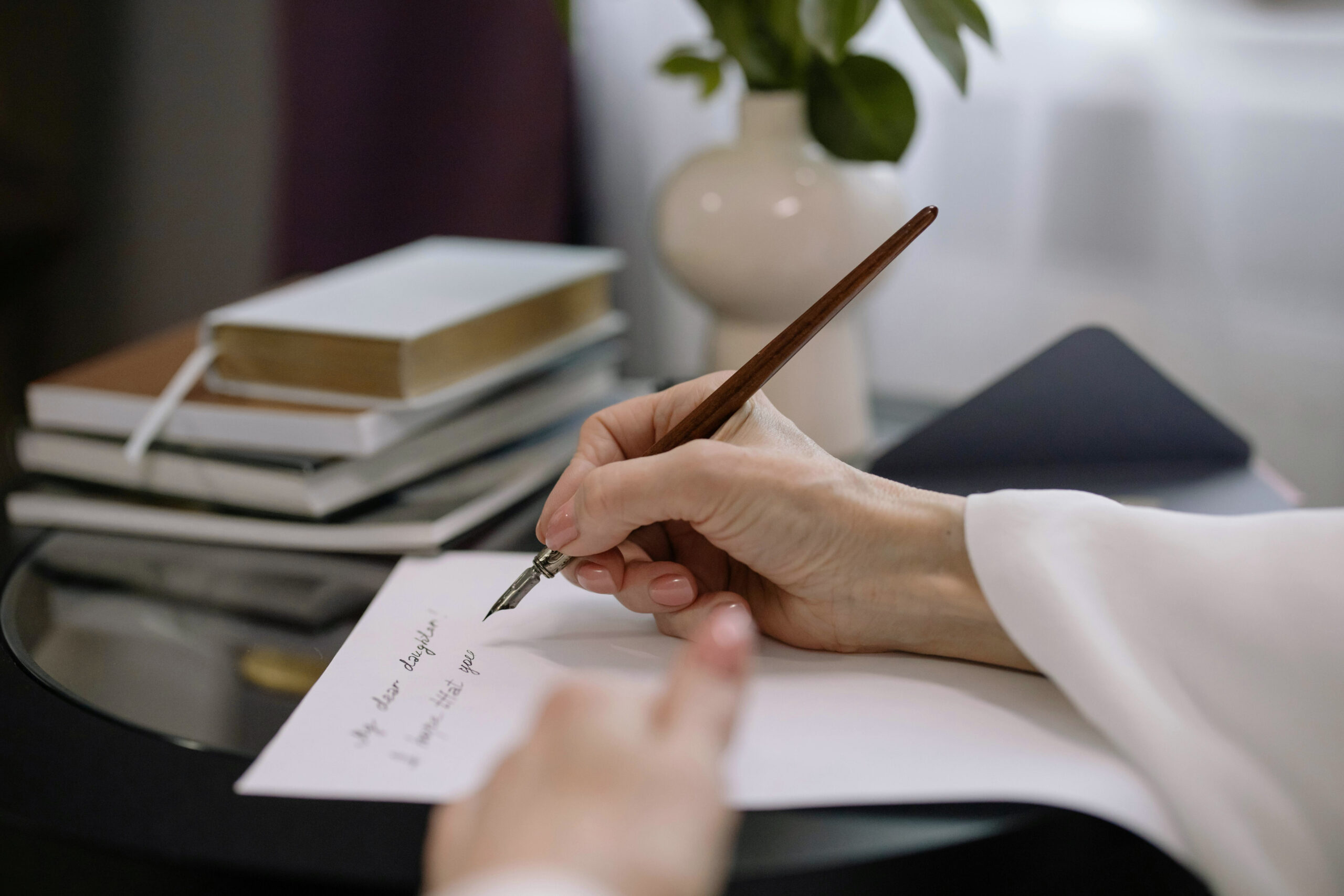 Closeup of hand writing for Make-A-Will Month